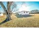 Back of the house with deck, outbuilding and lush surroundings at 3241 Broadnax Mill Rd, Loganville, GA 30052