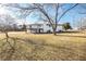The back of the house has a raised deck with stairs to the yard on a large lot at 3241 Broadnax Mill Rd, Loganville, GA 30052