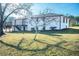 Spacious backyard with a modern deck and staircase offering an ideal spot for entertaining at 3241 Broadnax Mill Rd, Loganville, GA 30052
