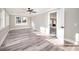 Bright bedroom with a ceiling fan and neutral tones, with a doorway view to the kitchen at 3241 Broadnax Mill Rd, Loganville, GA 30052