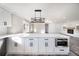 Bright kitchen featuring a white island with bar seating and stainless steel appliances at 3241 Broadnax Mill Rd, Loganville, GA 30052
