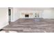 Spacious open-concept living area with gorgeous flooring, fireplace, and ample natural light at 3241 Broadnax Mill Rd, Loganville, GA 30052