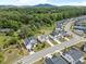 An aerial shot presents the neighborhood's homes nestled among green trees and manicured yards at 3525 Brynhurst Dr, Cumming, GA 30028