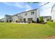 Expansive backyard with lush green lawn and patio, offering ample space for relaxation and outdoor activities at 3525 Brynhurst Dr, Cumming, GA 30028