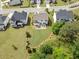 Aerial view of the well-manicured backyard featuring a patio and lush green lawn at 3525 Brynhurst Dr, Cumming, GA 30028