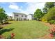 Beautifully landscaped backyard with manicured lawn, showcasing outdoor living and curb appeal at 3525 Brynhurst Dr, Cumming, GA 30028
