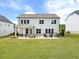 Spacious backyard featuring a patio seating area, perfect for enjoying outdoor living and entertaining at 3525 Brynhurst Dr, Cumming, GA 30028