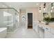 Spacious bathroom featuring a glass shower, soaking tub, and vanity with makeup space at 3525 Brynhurst Dr, Cumming, GA 30028