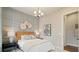 Well-decorated bedroom features modern lighting and a decorative accent wall at 3525 Brynhurst Dr, Cumming, GA 30028