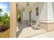 Inviting covered porch with chairs, decorative lights and nice landscaping at 3525 Brynhurst Dr, Cumming, GA 30028