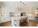 Modern kitchen featuring white cabinets, stainless steel appliances, and a large center island at 3525 Brynhurst Dr, Cumming, GA 30028