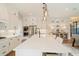 Bright, modern kitchen with white cabinets, a stainless steel refrigerator, and a large island with seating at 3525 Brynhurst Dr, Cumming, GA 30028