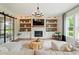 Inviting living room with a stone fireplace, built-in shelving, and comfortable seating at 3525 Brynhurst Dr, Cumming, GA 30028