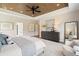 Light-filled main bedroom with natural wood ceiling, recessed lights, and ample windows at 3525 Brynhurst Dr, Cumming, GA 30028