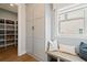 Cozy mudroom features built-in storage, a bench seat, and a window letting in natural light at 3525 Brynhurst Dr, Cumming, GA 30028