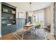 Stylish home office with custom shelving, a modern desk, and ample natural light at 3525 Brynhurst Dr, Cumming, GA 30028