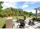 Charming outdoor seating area with stylish Adirondack chairs, ideal for relaxing and enjoying the backyard view at 3525 Brynhurst Dr, Cumming, GA 30028