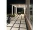 Covered patio with ample seating and elegant tile design, perfect for outdoor entertaining at 3525 Brynhurst Dr, Cumming, GA 30028