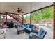 Covered back patio featuring a ceiling fan and comfortable seating, perfect for outdoor relaxation and entertaining at 3939 Soft Wind Ter, Buford, GA 30518