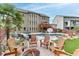 Lush backyard featuring a sparkling pool, palm trees, and ample seating areas for outdoor enjoyment and relaxation at 3939 Soft Wind Ter, Buford, GA 30518