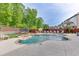 Beautiful backyard with a sparkling pool, lush landscaping, and plenty of space for outdoor activities and relaxation at 3939 Soft Wind Ter, Buford, GA 30518