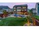 A backyard retreat featuring a beautiful pool, lush landscaping, and an elevated deck for outdoor enjoyment at 3939 Soft Wind Ter, Buford, GA 30518