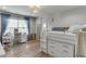 Cozy bedroom featuring a bunk bed, vanity desk with chair, and a window with curtains at 3939 Soft Wind Ter, Buford, GA 30518