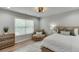 Inviting bedroom with a plush chair, natural light, and a soft color palette for a relaxing atmosphere at 3939 Soft Wind Ter, Buford, GA 30518