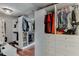 Walk-in closet with custom shelving, drawers, and hanging rods to optimize organization and storage at 3939 Soft Wind Ter, Buford, GA 30518