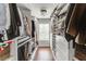 Organized walk-in closet with custom shelving, drawers, and hanging rods for efficient storage and organization at 3939 Soft Wind Ter, Buford, GA 30518