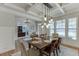 Cozy dining room featuring coffered ceilings and stylish lighting fixtures, perfect for Gathering gatherings at 3939 Soft Wind Ter, Buford, GA 30518