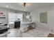 Bright home office featuring a large window, white desk, and decorative accents at 3939 Soft Wind Ter, Buford, GA 30518