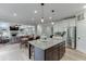 Open kitchen with a large island, stainless steel appliances, and open floor plan at 3939 Soft Wind Ter, Buford, GA 30518
