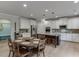 A bright kitchen with white cabinets, granite countertops, stainless appliances and large island at 3939 Soft Wind Ter, Buford, GA 30518