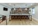 Open concept kitchen with large island, seating, exposed brick and stainless steel appliances at 3939 Soft Wind Ter, Buford, GA 30518