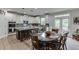 Bright kitchen featuring white cabinets, an island with seating, and stainless steel appliances at 3939 Soft Wind Ter, Buford, GA 30518