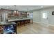 Stylish kitchen with exposed brick wall, large center island with seating and stainless steel appliances at 3939 Soft Wind Ter, Buford, GA 30518