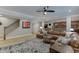 Spacious living area with a large sectional, open to the kitchen, with stairs nearby at 3939 Soft Wind Ter, Buford, GA 30518
