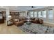 Open living room showcasing a large leather sectional and view into the kitchen at 3939 Soft Wind Ter, Buford, GA 30518