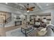 Spacious open-concept living room with hardwood floors, and view of the kitchen at 3939 Soft Wind Ter, Buford, GA 30518