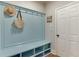 Charming mudroom features beadboard accent wall, built-in bench and storage cubbies for organization at 3939 Soft Wind Ter, Buford, GA 30518