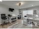 Functional home office with a large window, neutral walls, and ample workspace for productivity and creativity at 3939 Soft Wind Ter, Buford, GA 30518