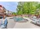 Inviting backyard pool with a fountain feature and poolside seating, surrounded by lush landscaping at 3939 Soft Wind Ter, Buford, GA 30518