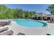 Community pool with plenty of chaise lounges, tables, and seating options surrounding the pool at 3939 Soft Wind Ter, Buford, GA 30518