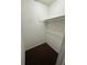 Interior of closet with hanging rail, shelf, and carpet floor for storage at 5846 Par Four Ct, Lithonia, GA 30038