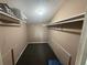 Inside of closet, with hanging rail, and plenty of storage space at 5846 Par Four Ct, Lithonia, GA 30038