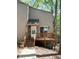 Cozy home featuring a wood deck entrance, wood siding, and a well-maintained walkway at 5846 Par Four Ct, Lithonia, GA 30038