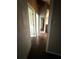 Hallway with wood-look flooring and neutral paint provides access to other rooms at 5846 Par Four Ct, Lithonia, GA 30038