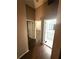 Hallway with bathroom access offers passage to other parts of the home at 5846 Par Four Ct, Lithonia, GA 30038
