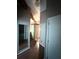 View of hallway with wood floors and accent beams on ceiling at 5846 Par Four Ct, Lithonia, GA 30038
